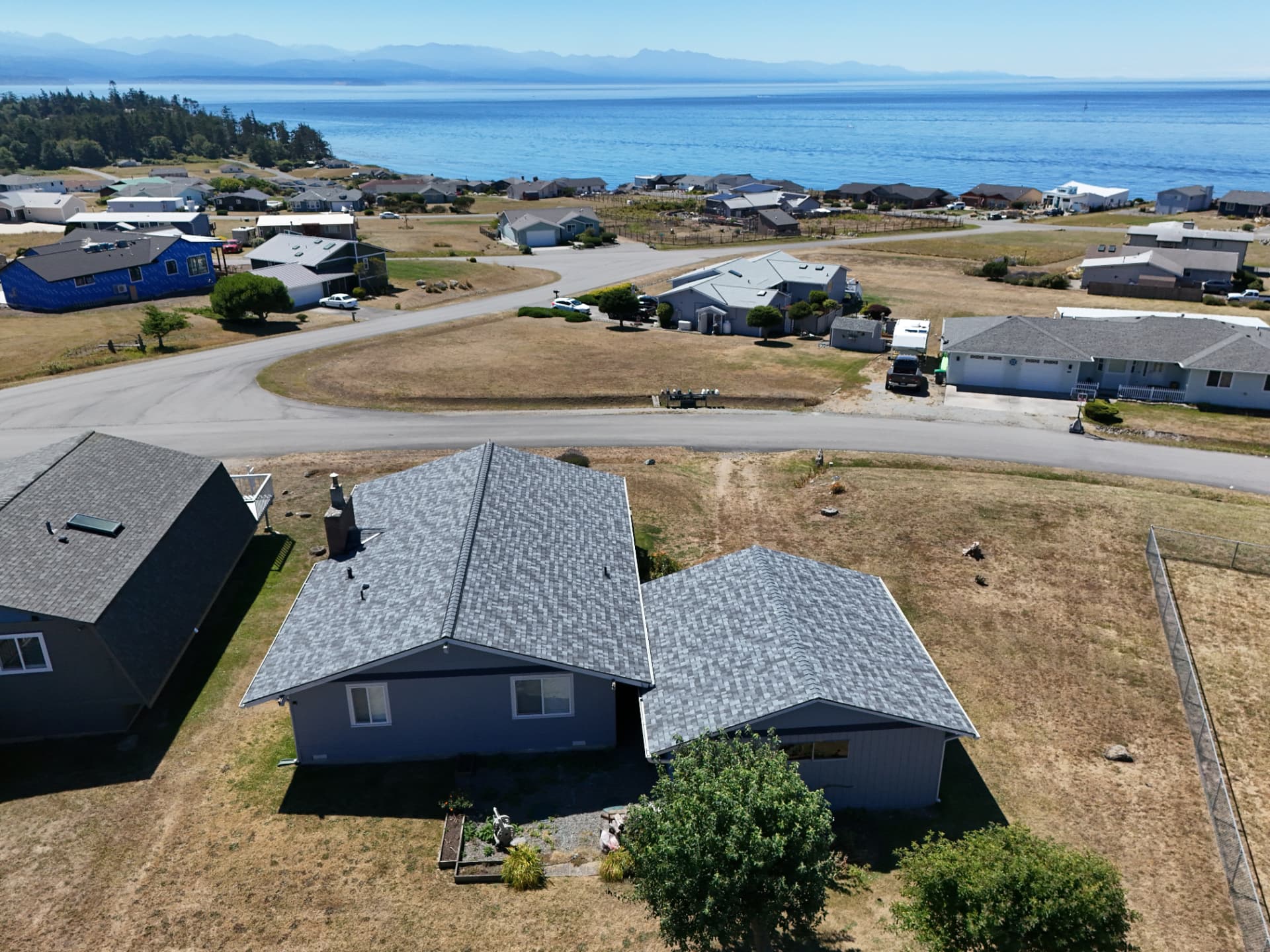 Overhead drone view of a Blitz Roofing LLC asphalt shingle roof replacement in the Lynnwood, WA area